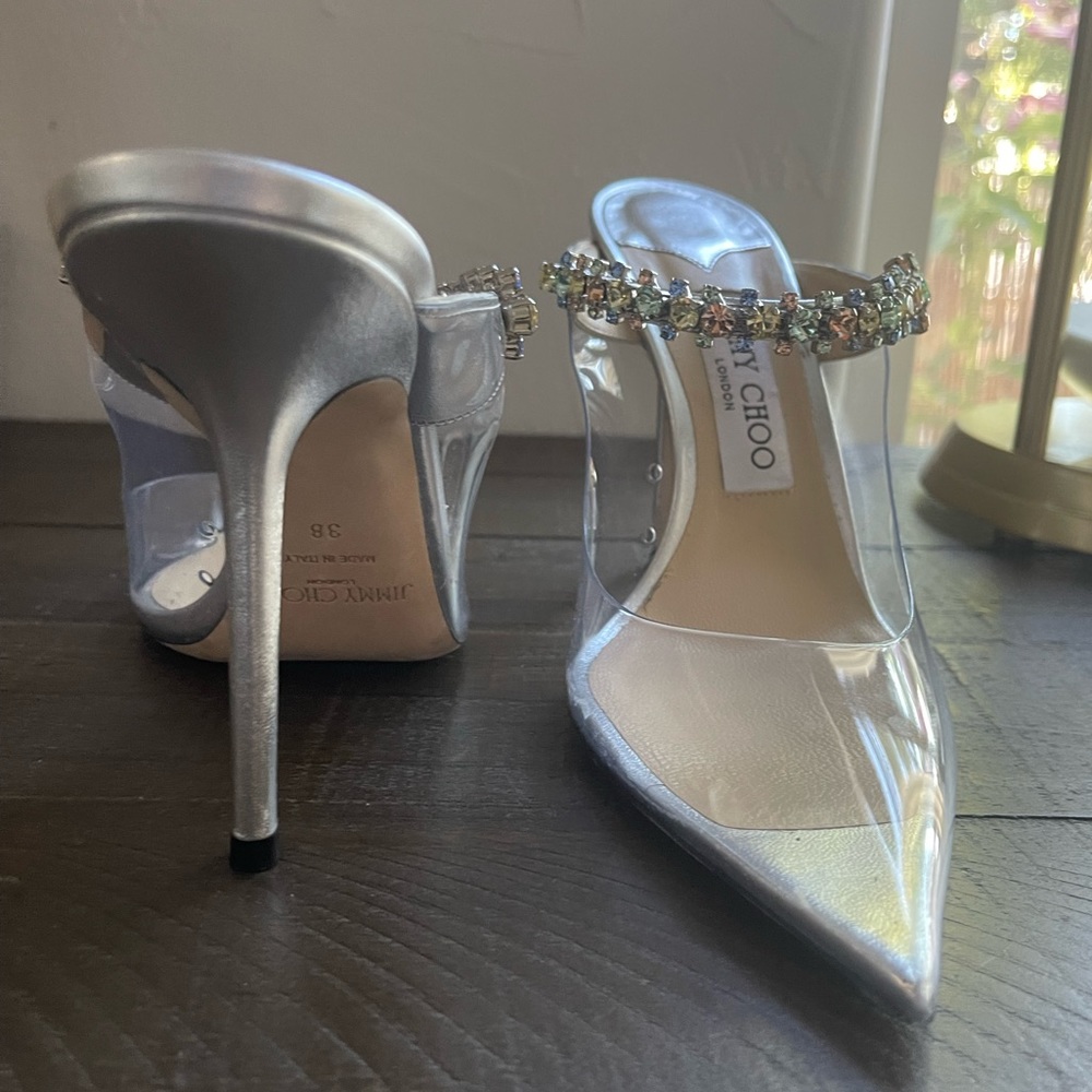 JIMMY CHOO
Bing 100 crystal-embellished PVC and metallic leather mules